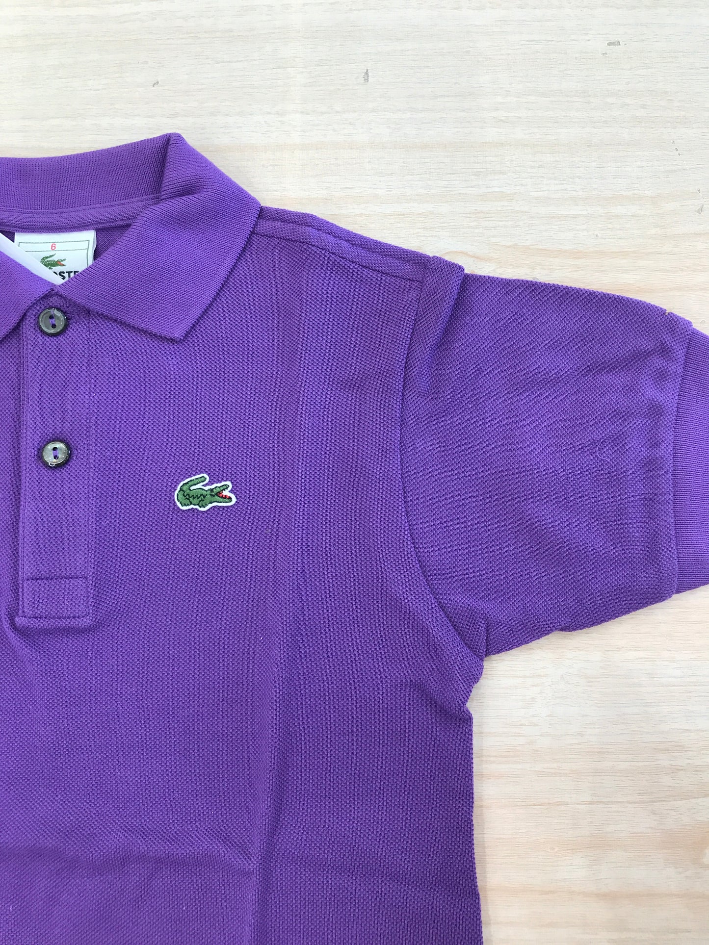 Polo Lacoste in cotone mezza manica con bottoncini e logo ricamato lateralmente unisex