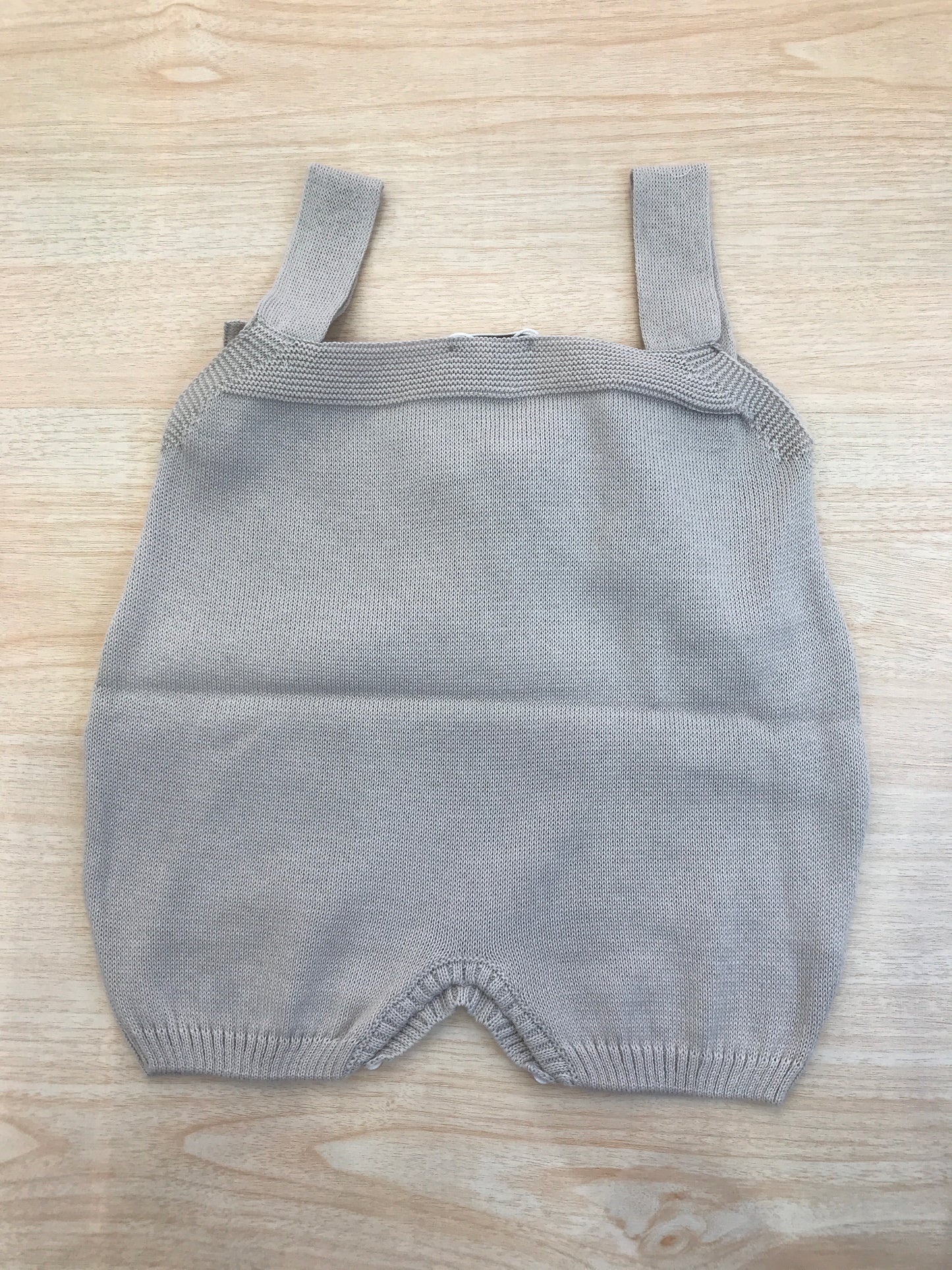 Salopette Baby Lord in filo con bretelle con fiocco rosa sul davanti