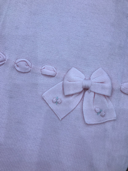Coperta Baby Lord in lana rosa con passanastro e fiocco con roselline ricamate
