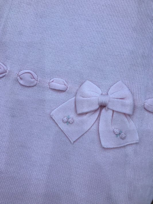 Coperta Baby Lord in lana rosa con passanastro e fiocco con roselline ricamate