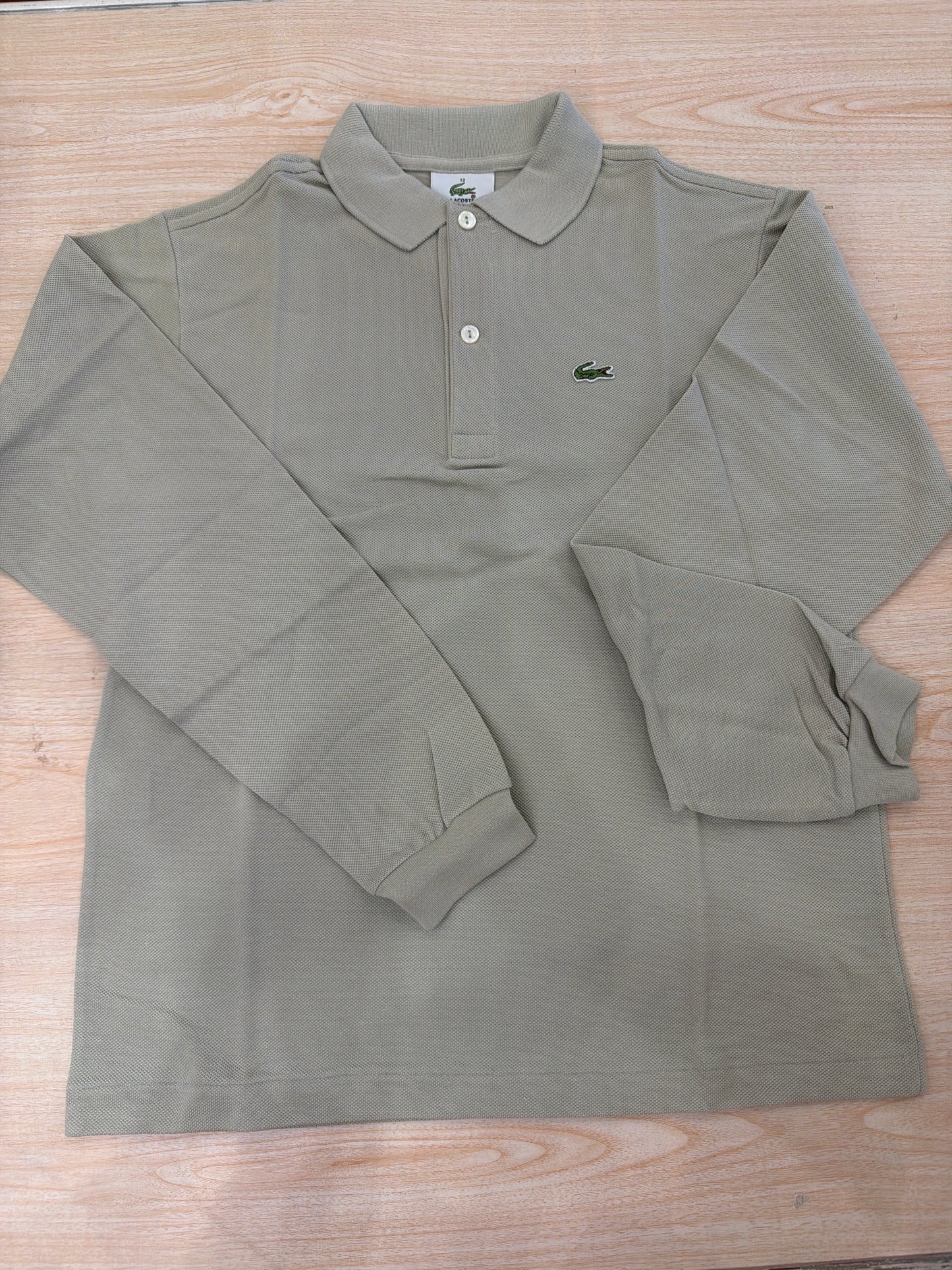 Polo Lacoste in cotone manica lunga con bottoncini e logo ricamato lateralmente unisex