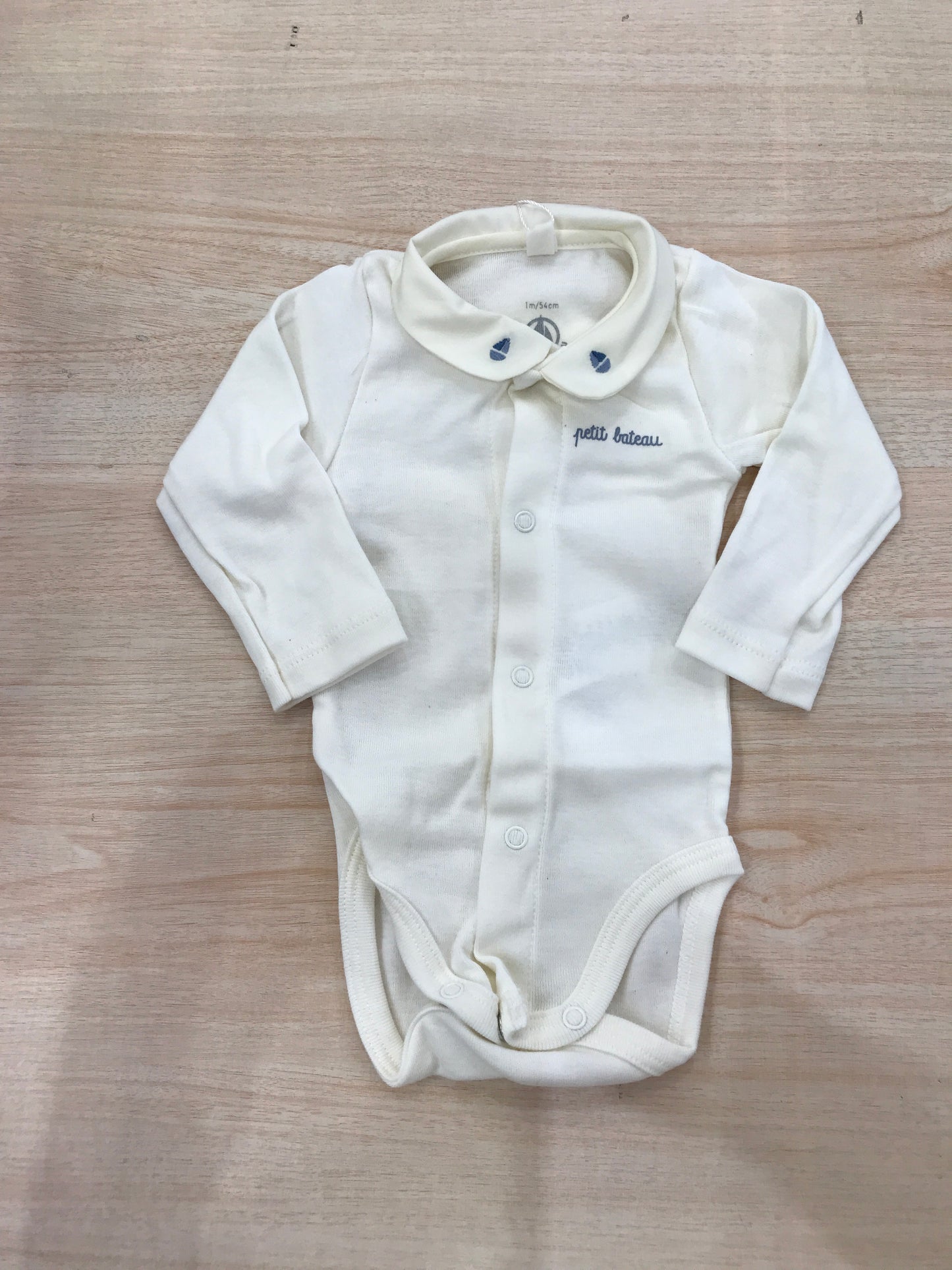 Body Petit Bateau in cotone manica lunga panna con barche ricamate sul colletto