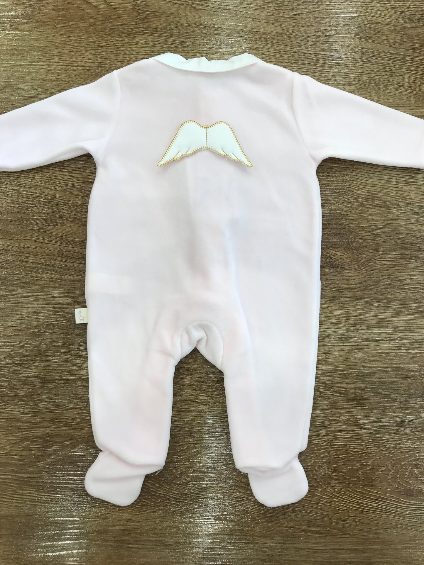 Tutina Baby Gi in ciniglia rosa intera con ali rifinite sul retro