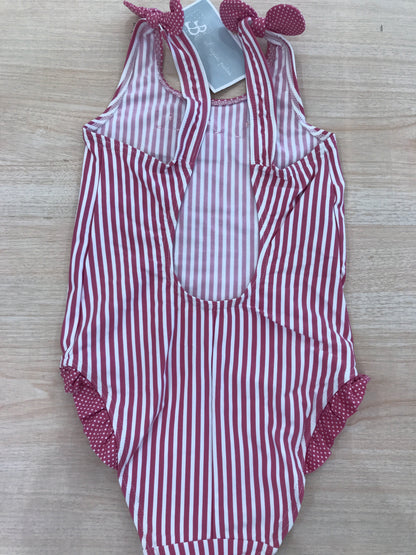 Costume Al Agua Patos intero a righe bianche e fucsia con bretelle con fiocchetto e rusche