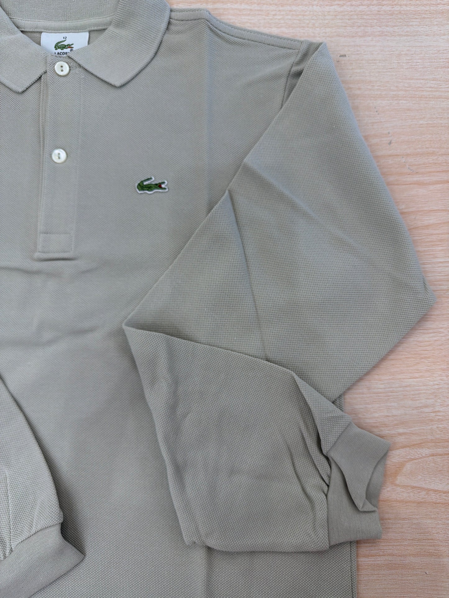 Polo Lacoste in cotone manica lunga con bottoncini e logo ricamato lateralmente unisex