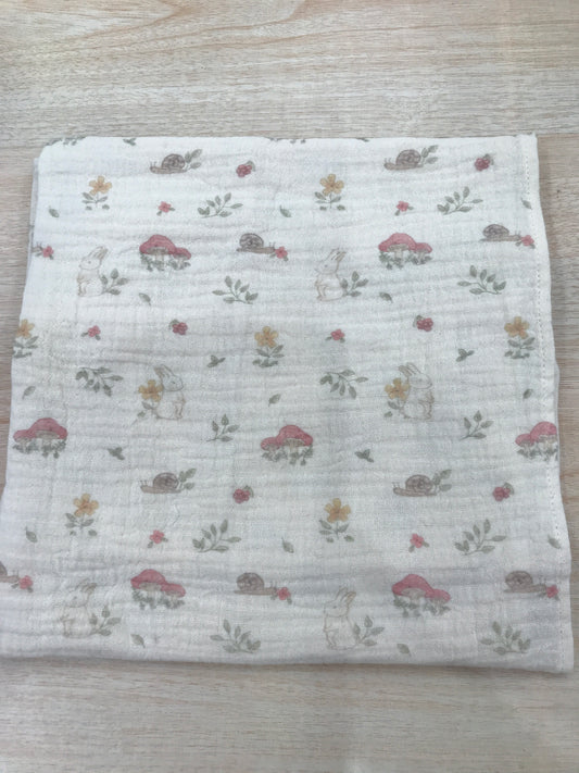 Mussola Baby Gi in garza beige con piccoli animaletti