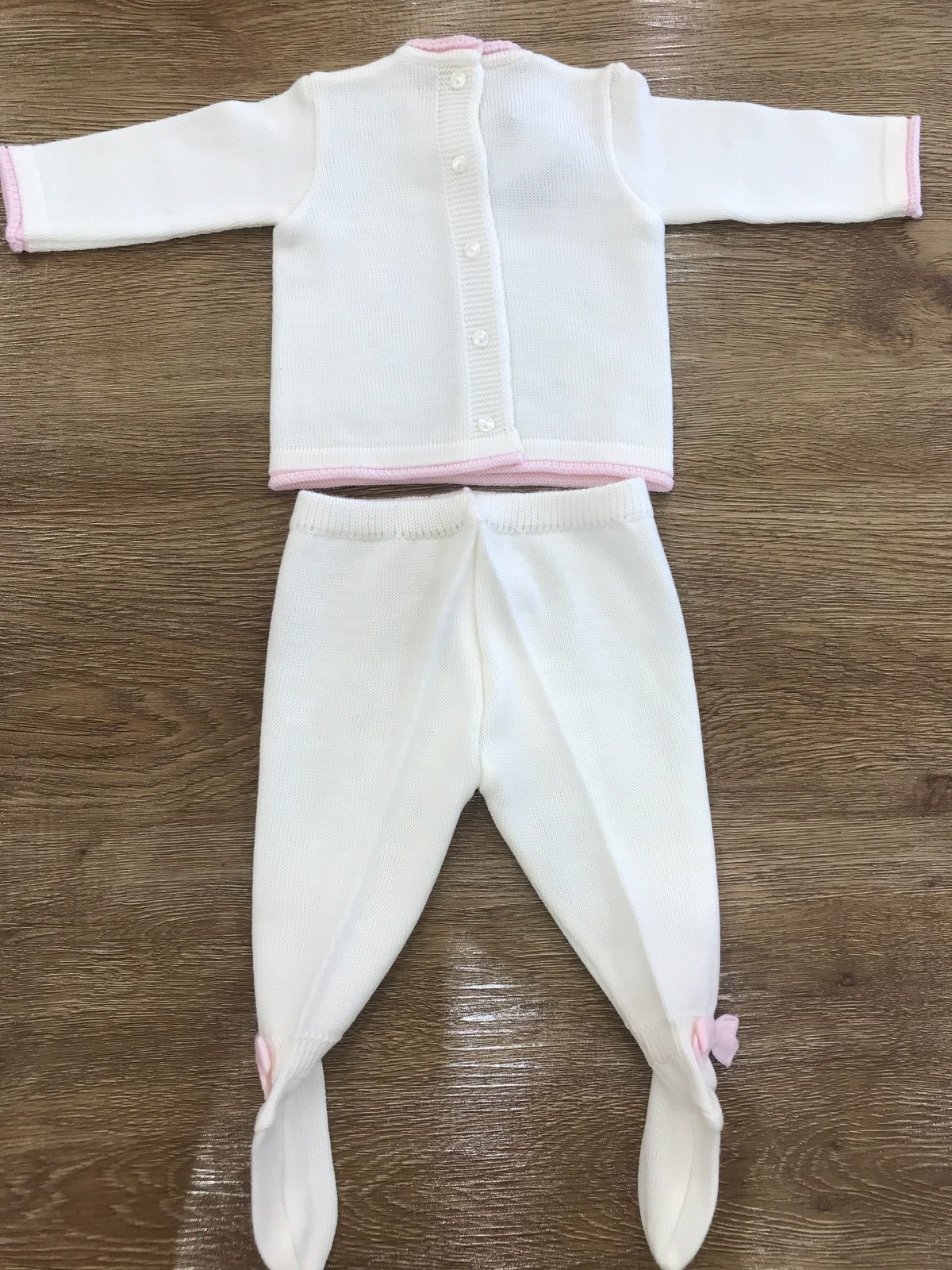 Tutina Baby Lord in lana panna due pezzi con piccoli fiocchetti rosa