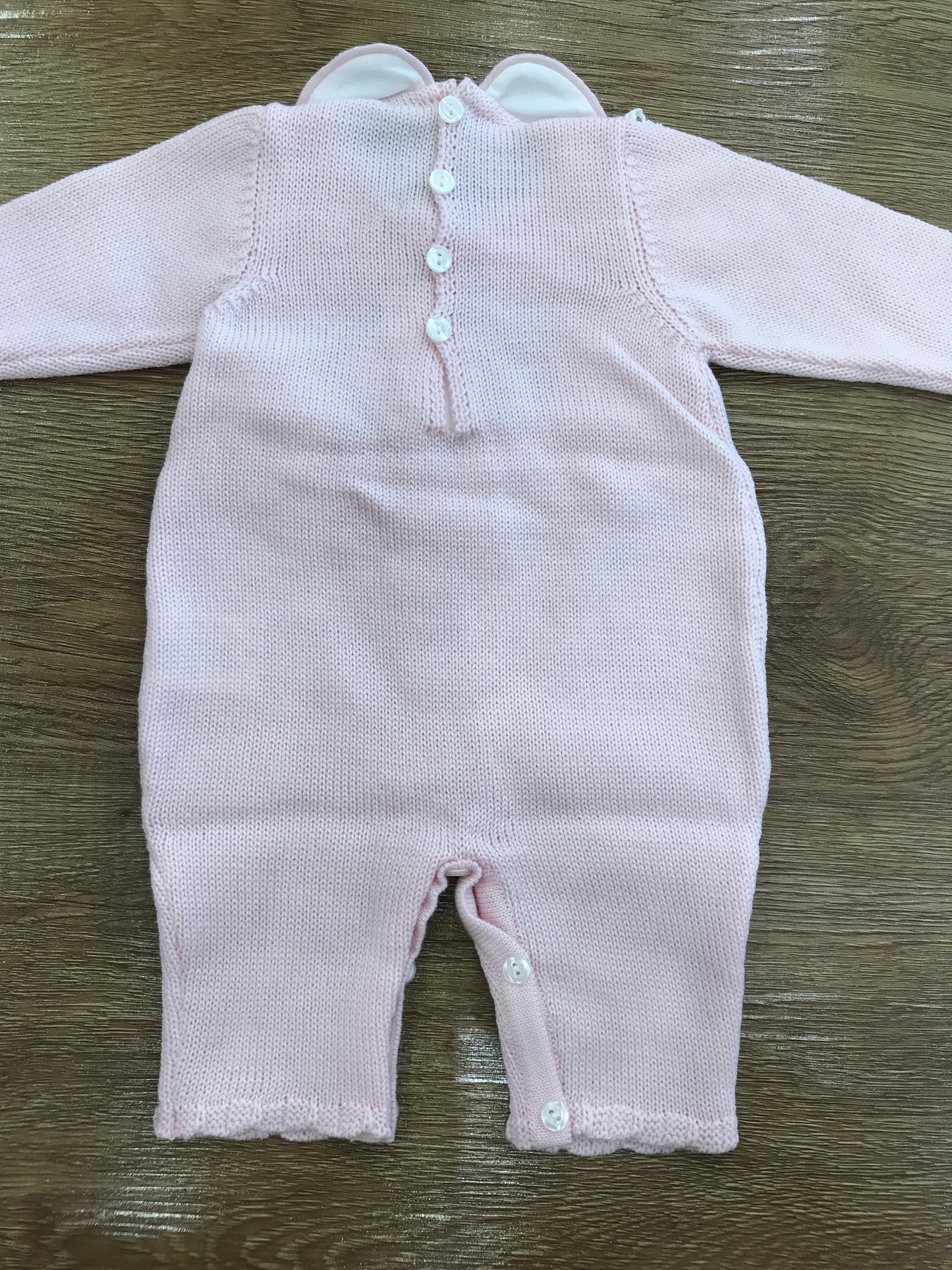 Tutina Bebè di Almy in lana rosa intera con applicazione di valancienne e corpetto lavorato
