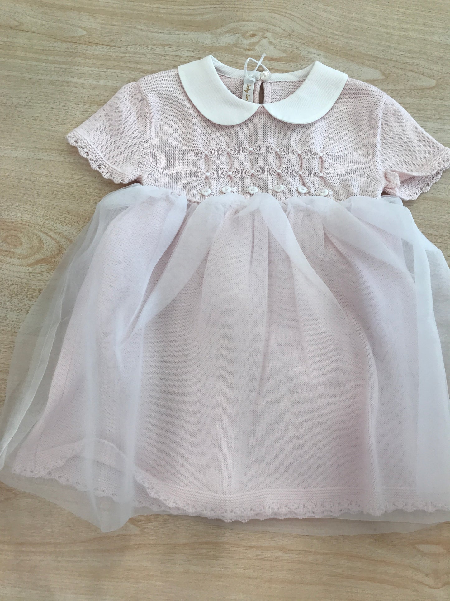 Abito Baby Lord in filo rosa mezza manica con strato in tulle e lavorazione di punto smock