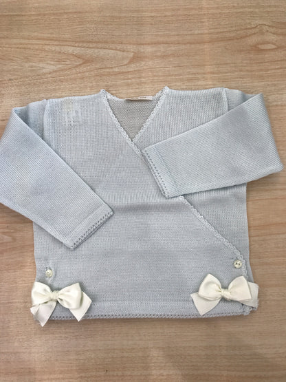 Cardigan Baby Lord in filo celeste ad incrocio con fiocchetti bianchi