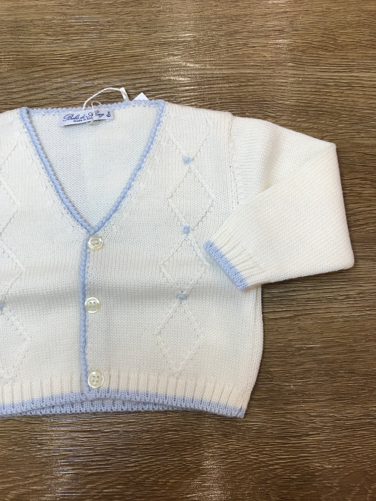 Cardigan Bebè di Almy in lana panna con rifiniture celesti