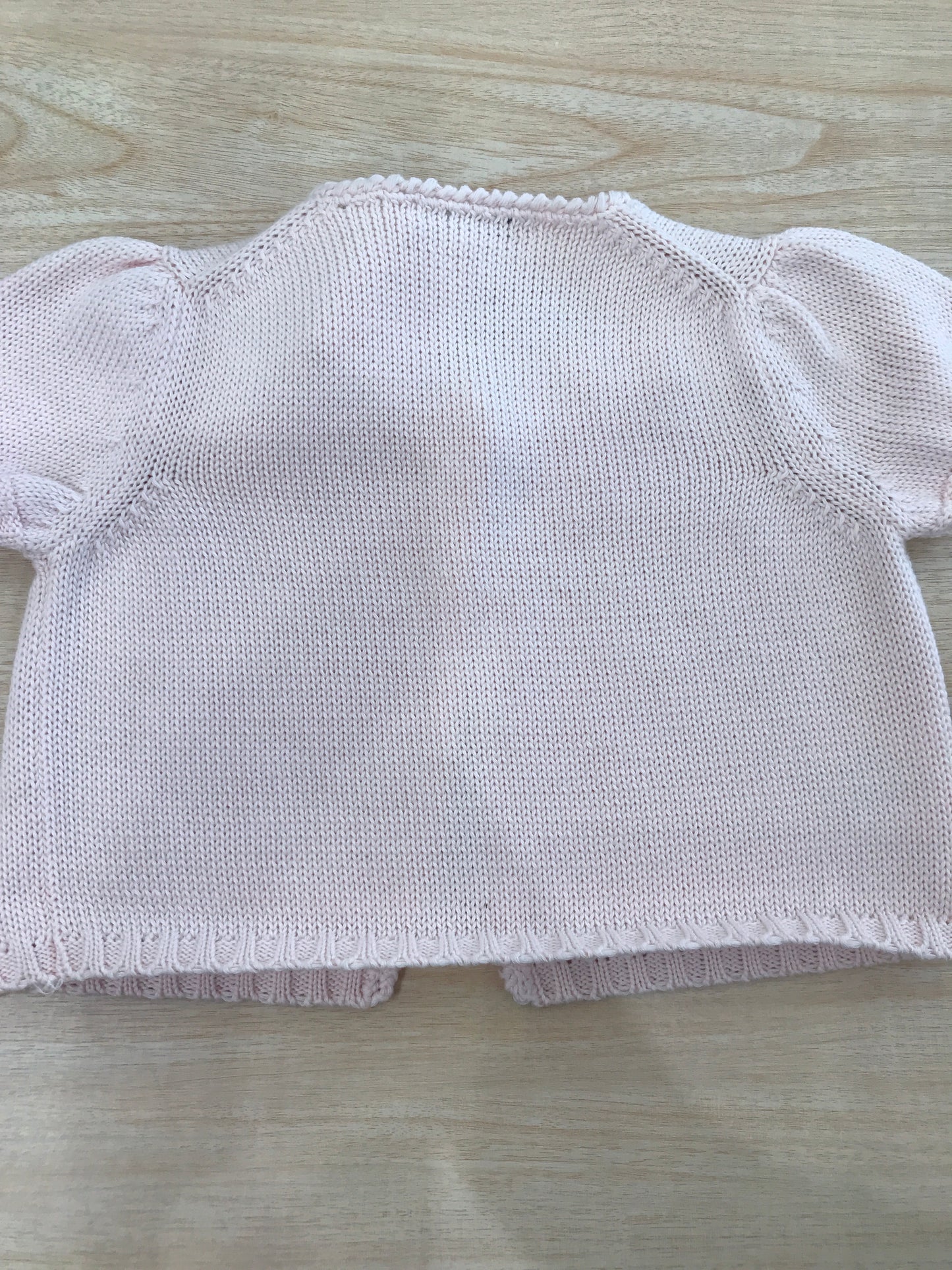 Cardigan Colibrì in filo rosa mezza manica con un piccolo bottoncino