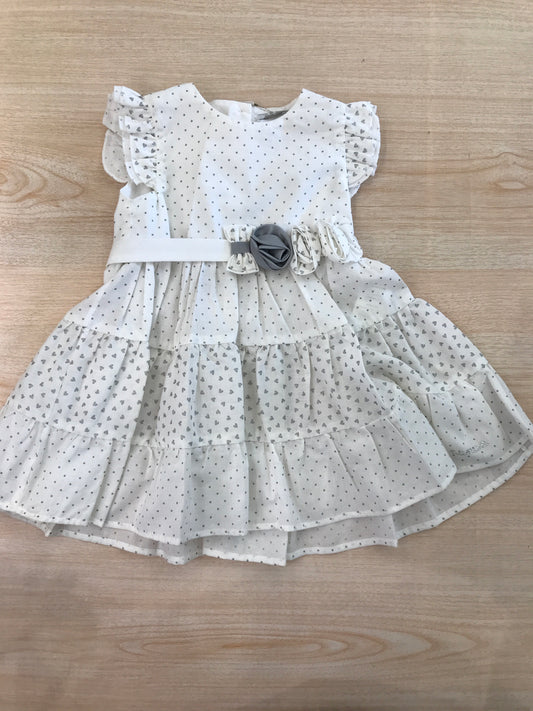 Abito Nanan in cotone bianco a pois grigi smanicato con rusche con fiori applicati lateralmente