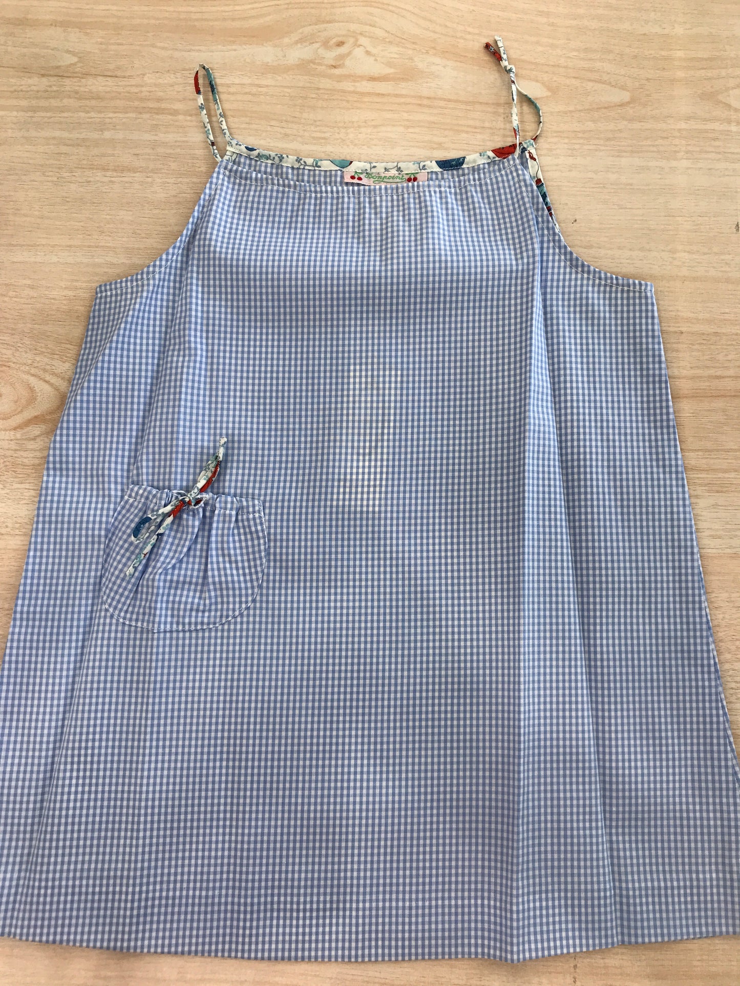 Abito Bonpoint in cotone a quadretti bianchi e celesti con bretelle a fiori