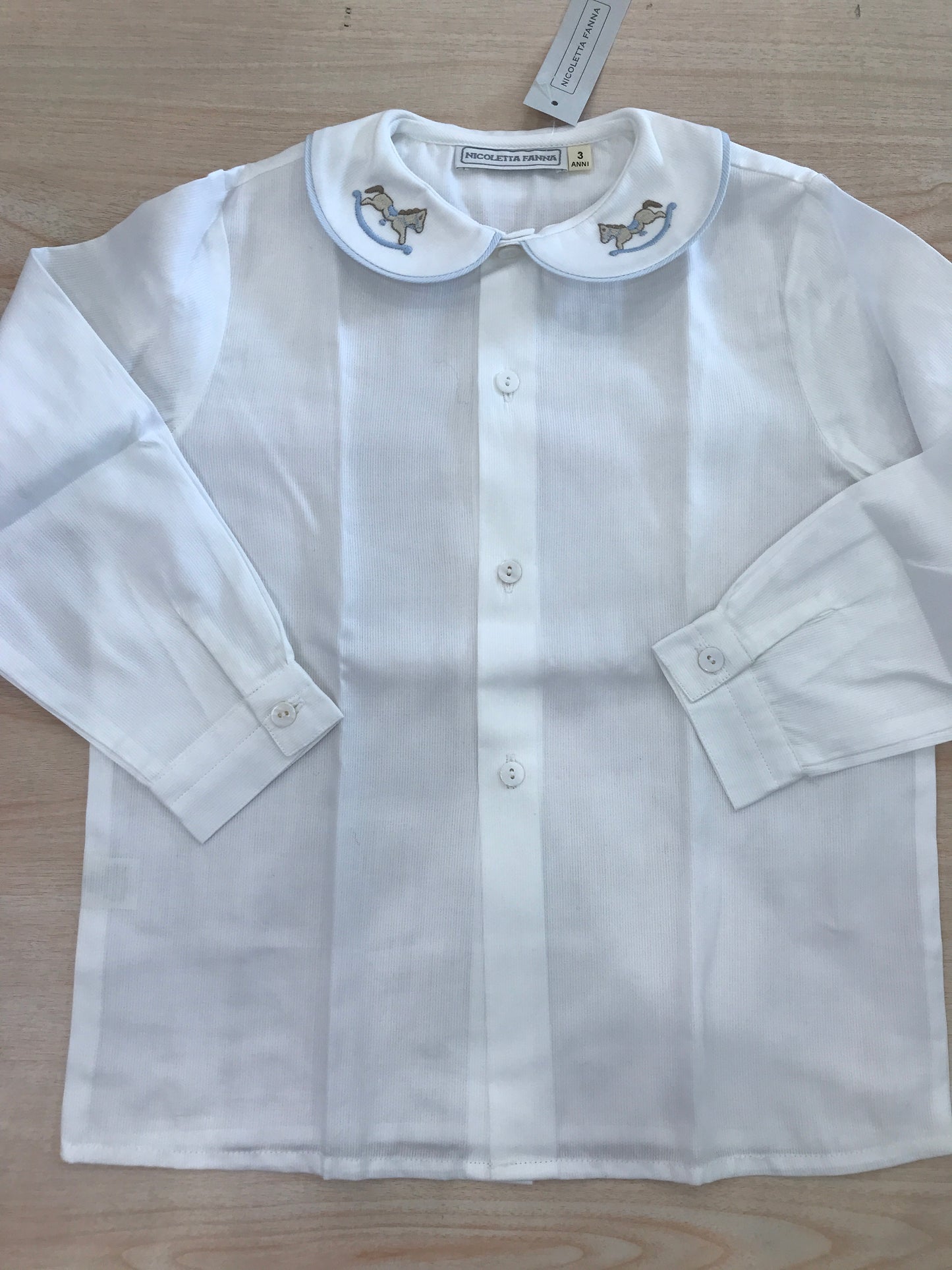 Camicia Nicoletta Fanna in cotone manica lunga con colletto rifinito in celeste e cavallo a dondolo