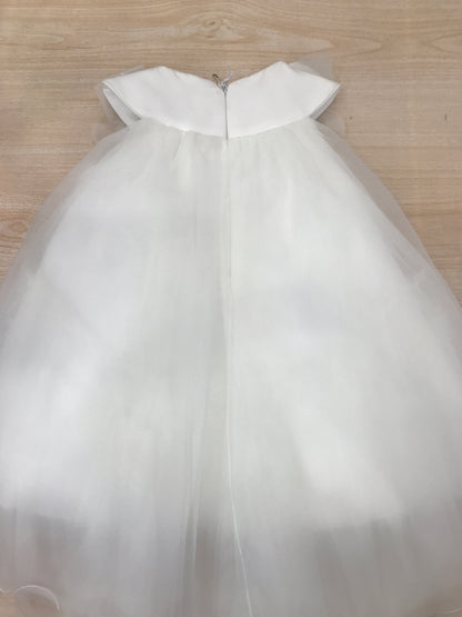 Abito Nanan in tulle corto sul davanti e lungo sul retro smanicato con fiori sul colletto
