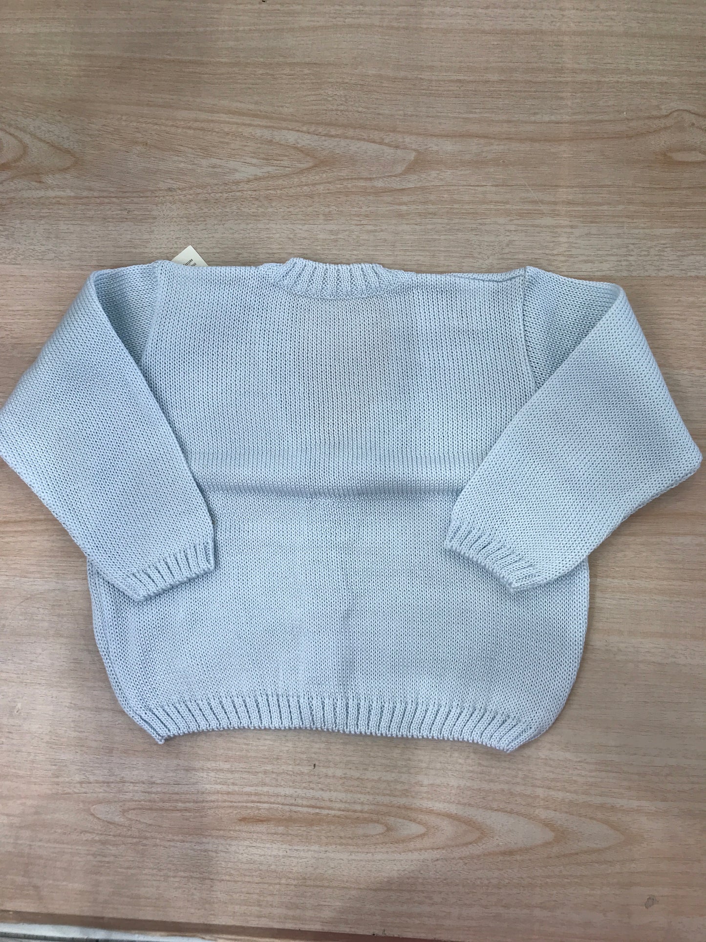 Cardigan Baby Lord in filo celeste con scollo tasche e piccoli bottoncini
