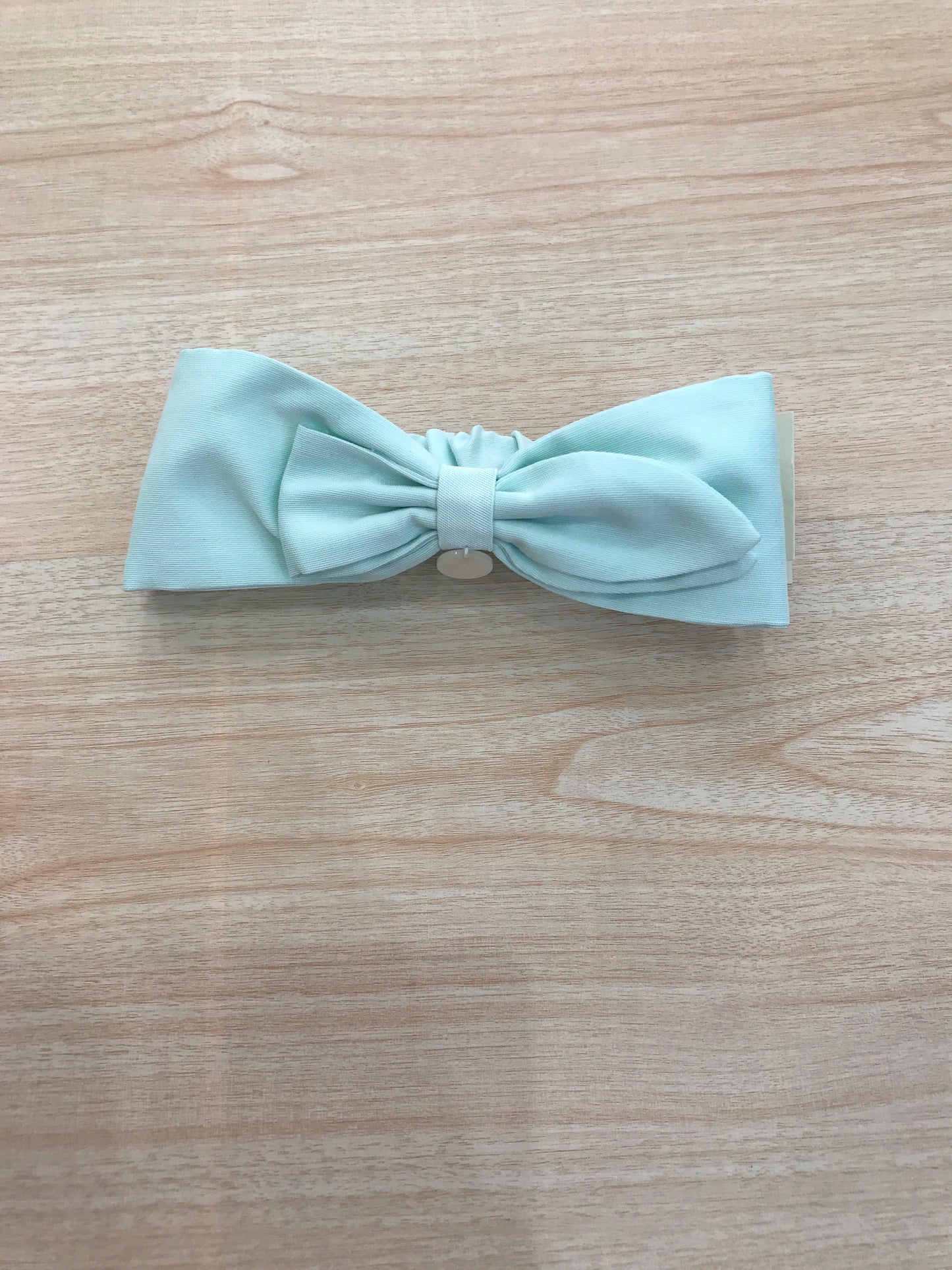 Fascia Le Bebè in cotone verde acqua a forma di fiocco con elastico sul retro