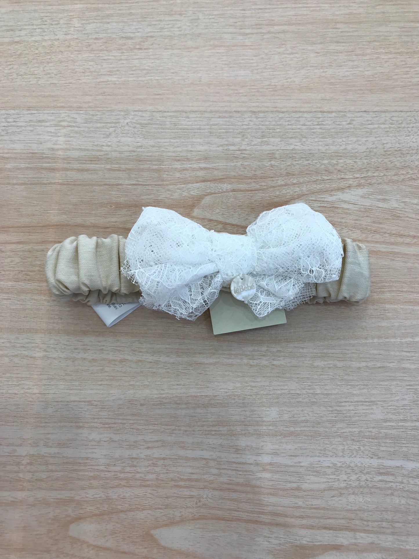 Fascia Le Bebè in cotone con fiocco in pizzo bianco applicato sul davanti