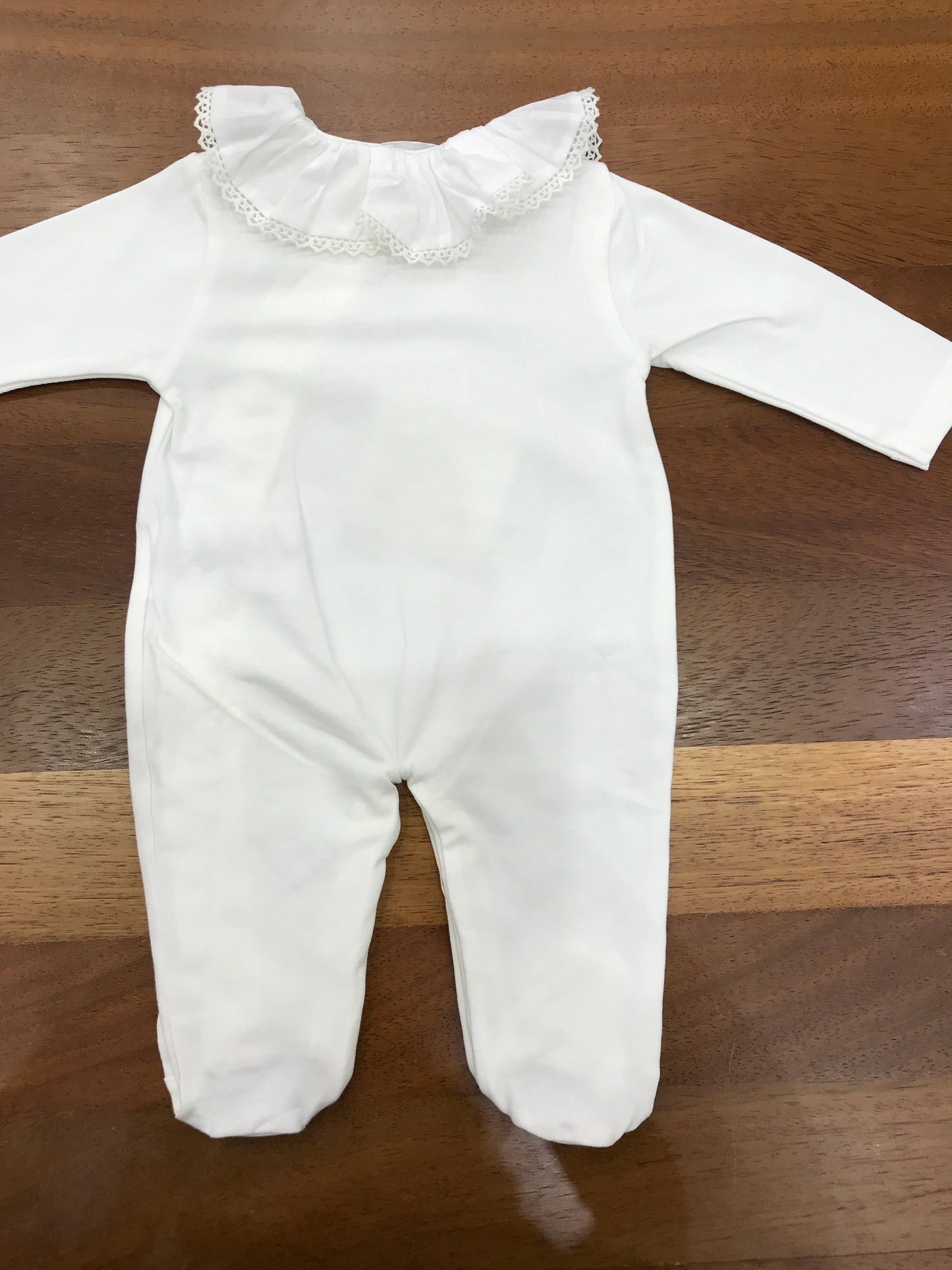 Tutina Nanan in cotone manica lunga con piedini collo con rusche bianca