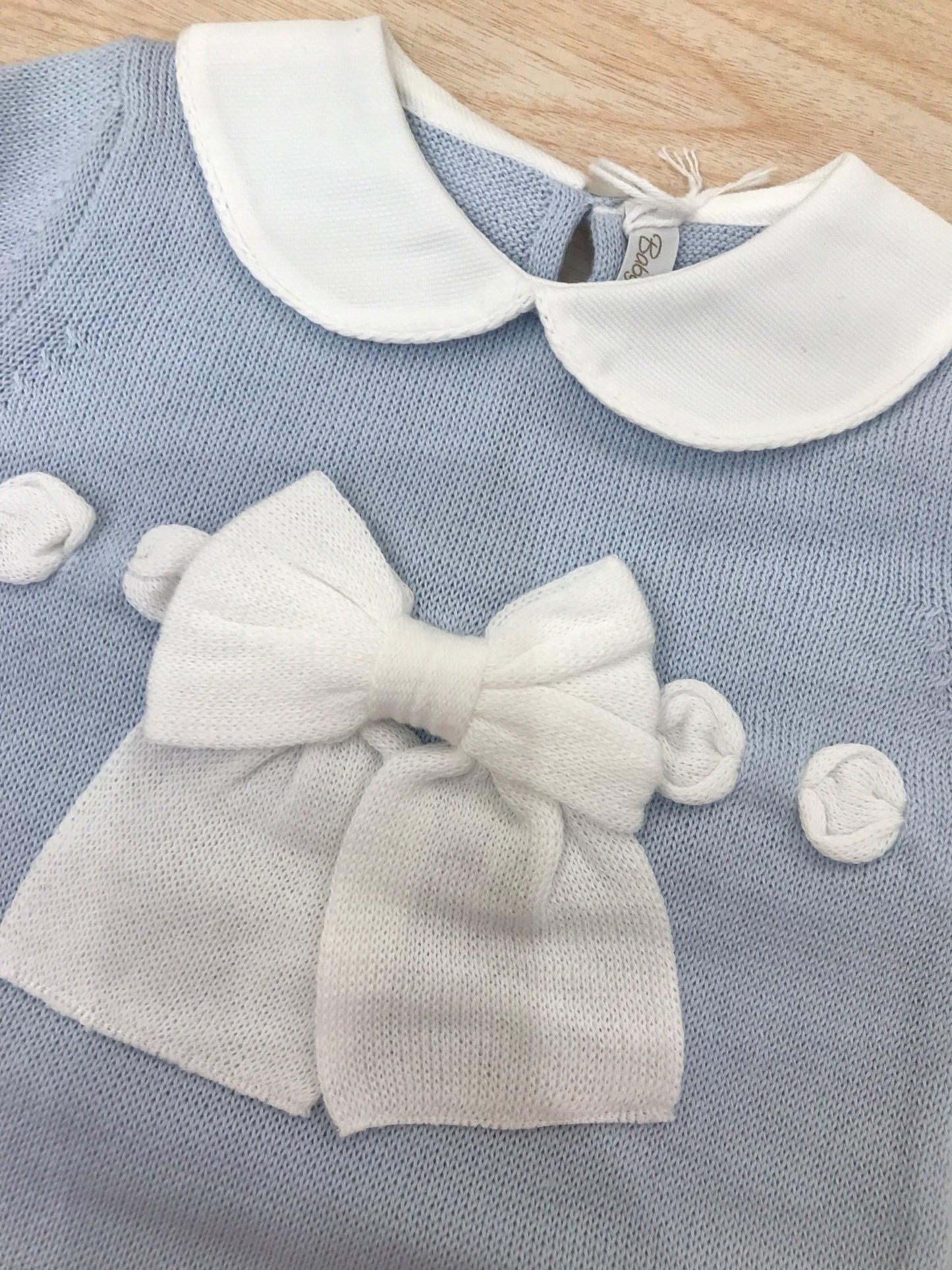 Pagliaccetto Baby Lord in filo mezza manica con passanastro e fiocchetto bianco