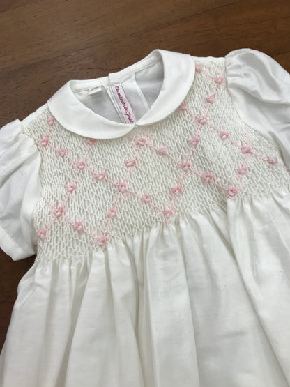 Abito Les enfants de Gisele in saten con corpetto lavorato da punto smock e rose ricamate