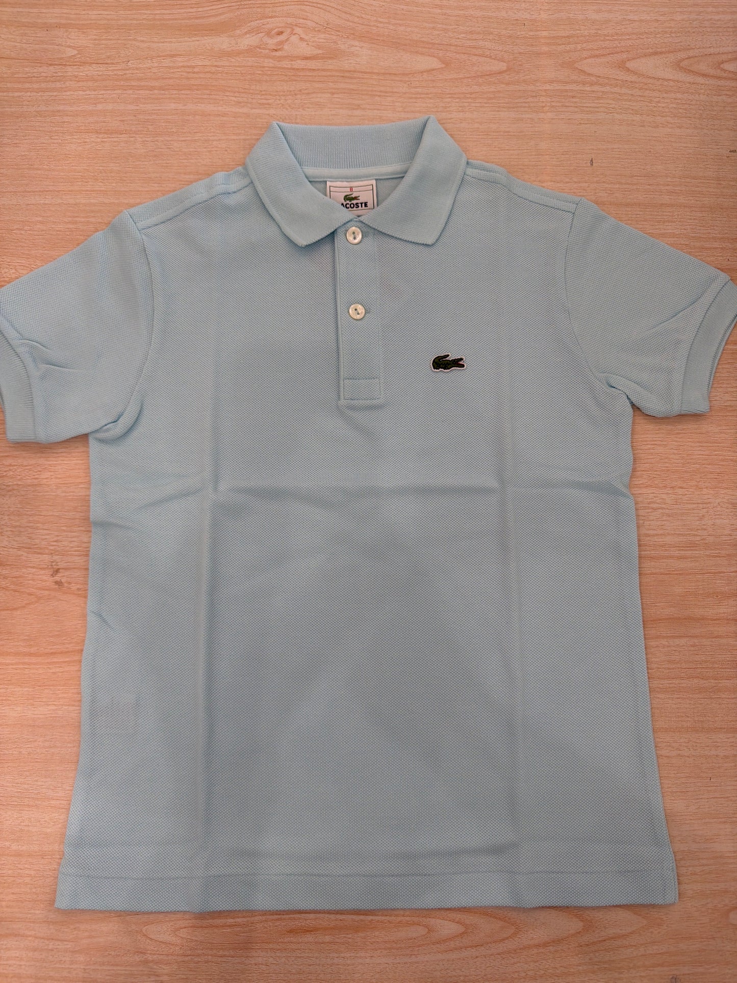 Polo Lacoste in cotone mezza manica con bottoncini e logo ricamato lateralmente unisex