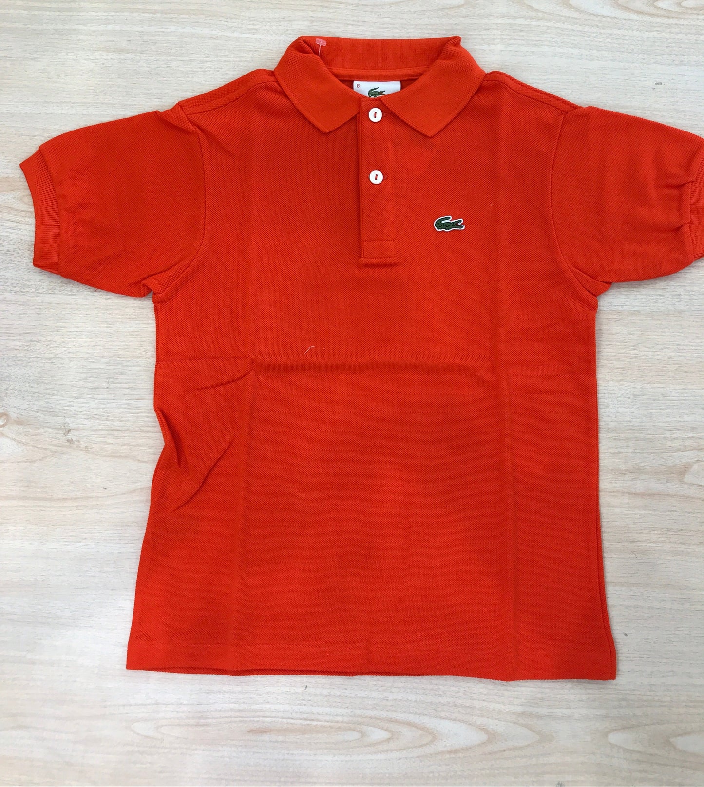 Polo Lacoste in cotone mezza manica con bottoncini e logo ricamato lateralmente unisex