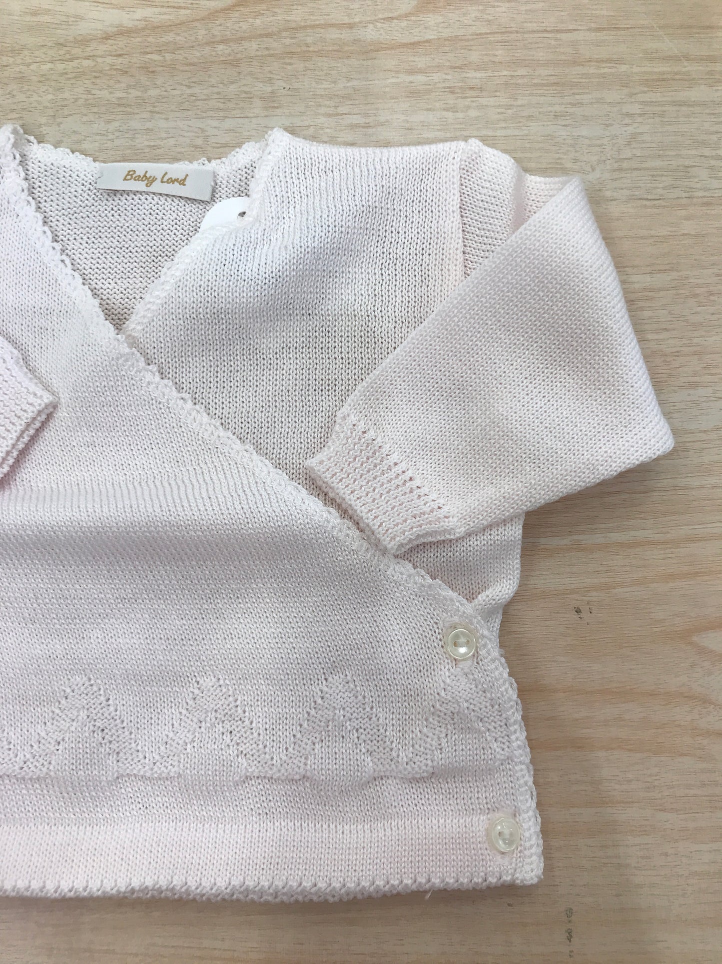 Cardigan Baby Lord in filo ad incrocio con rifiniture in basso