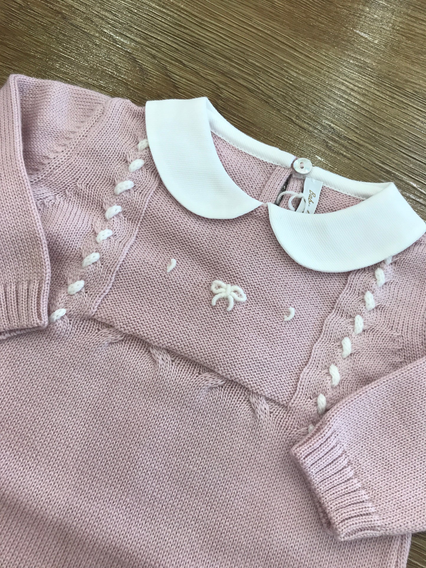 Tutina Baby Lord intera in lana rosa antico con fiocchetto ricamato sul davanti
