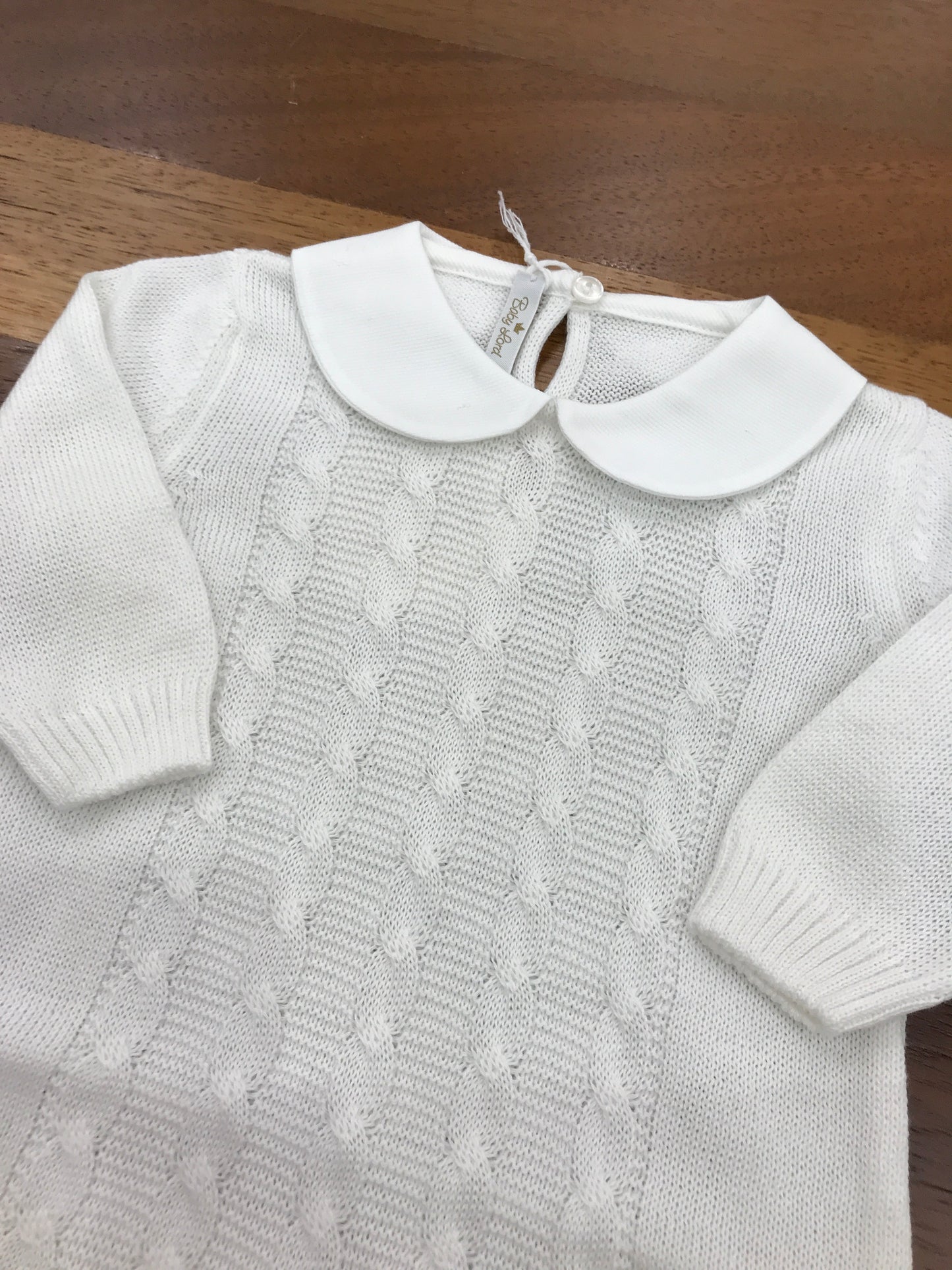 Tutina Baby Lord in filo bianca manica lunga con lavorazione di trecce con collo tondo