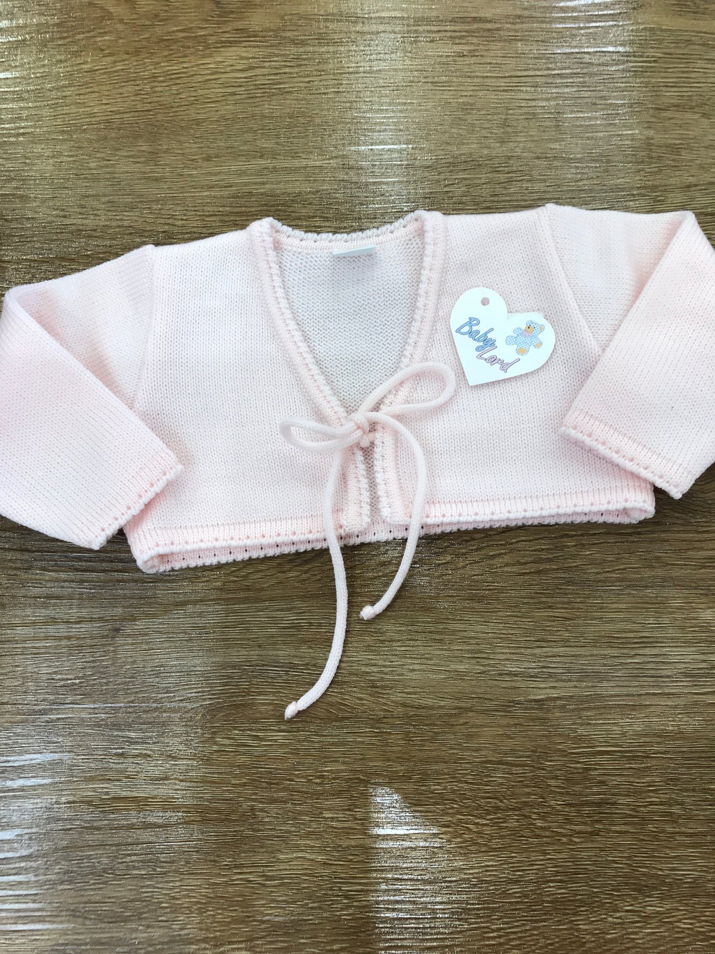 Cardigan Baby Lord in lana rosa con fiocchetto per chiusura