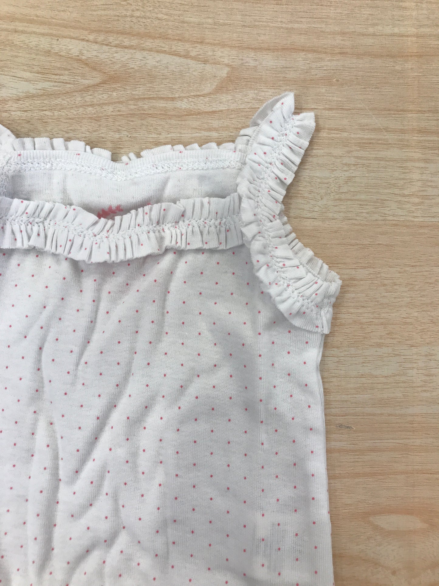 Body Coccodè in cotone bianco con pois rosa spalline con rusche