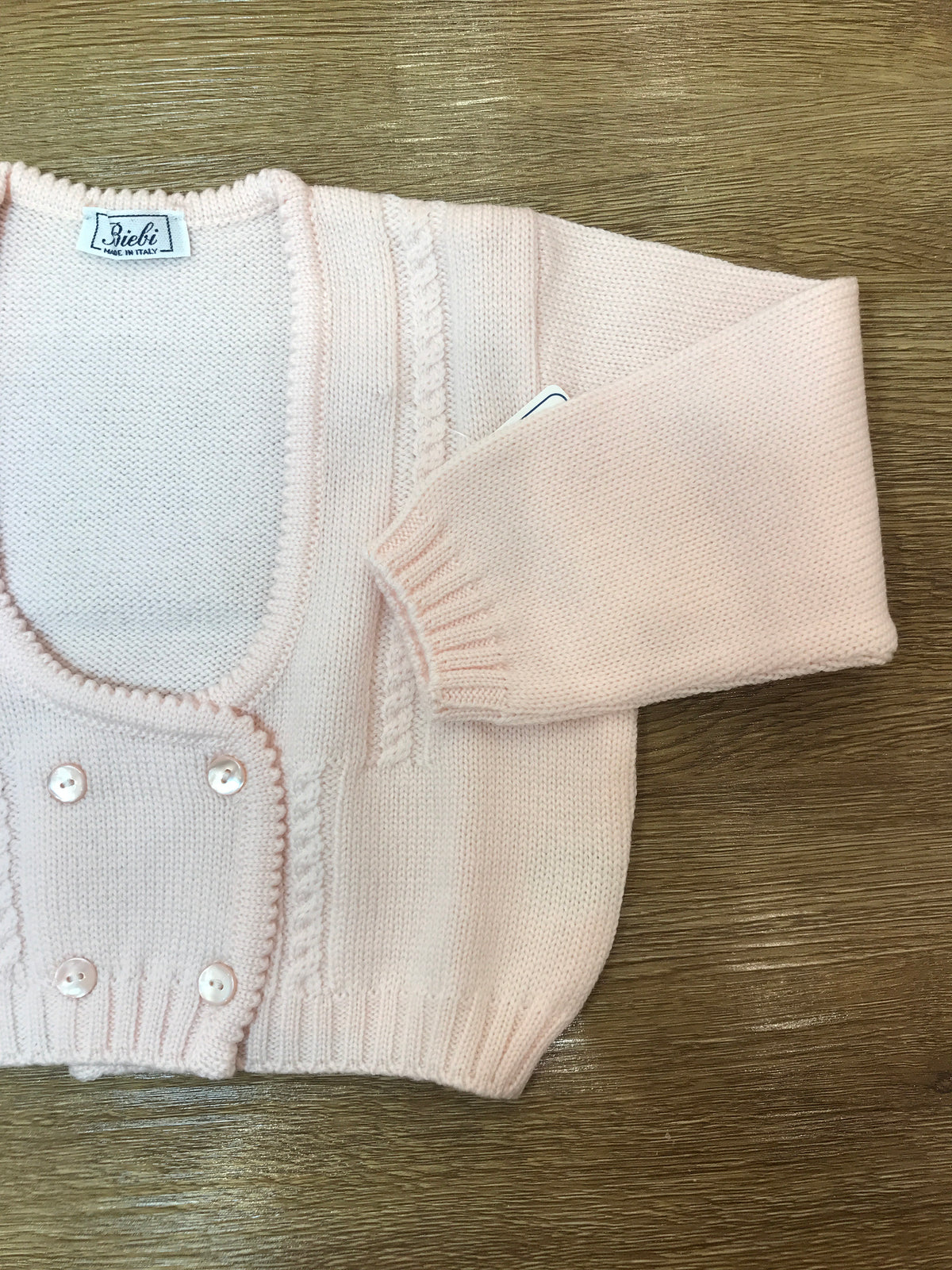 Cardigan Biebi in lana rosa pesca chiusura doppiopetto con lavorazione di trecce e piccoli bottoncini
