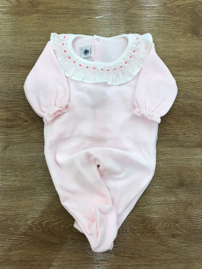 Tutina Petit Bateau in ciniglia rosa intera con collo con rusche e pois