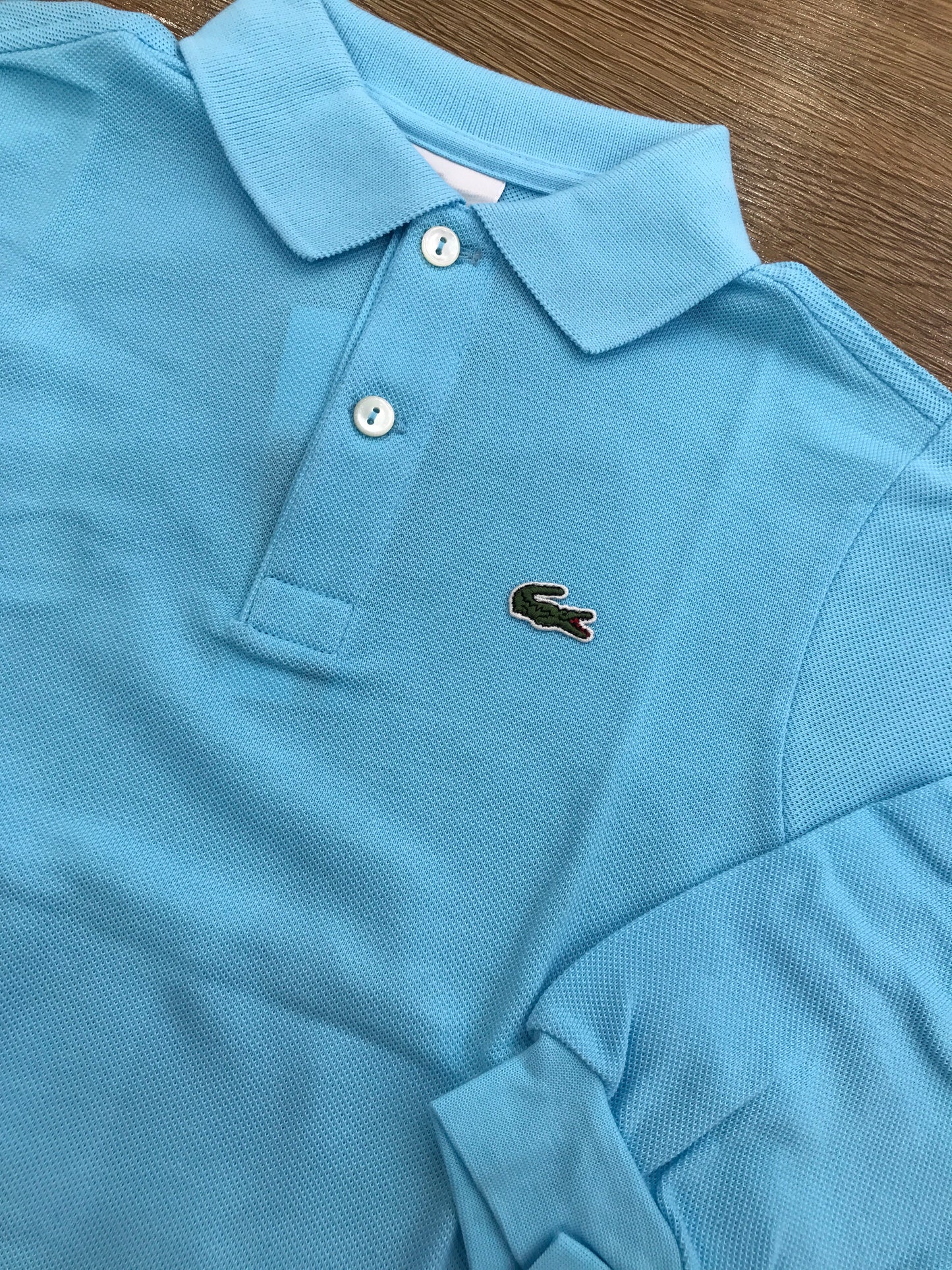 Polo Lacoste manica lunga con polsini e bottoncini