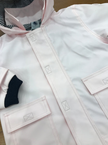 Giubbotto Impermeabile Petit Bateau rosa con cappuccio con zip e strappo e tasche sul davanti