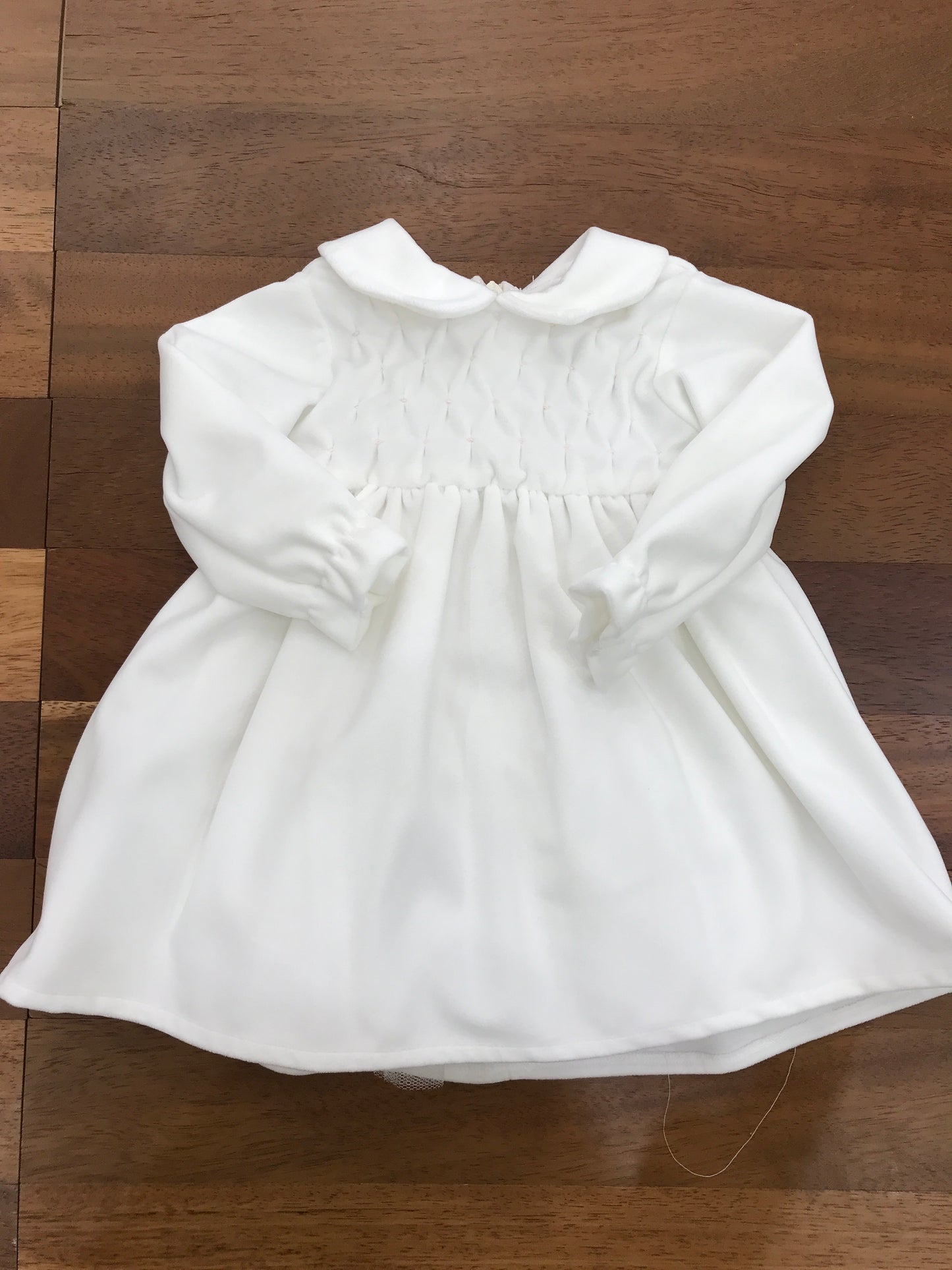 Abitino Colibrì in velluto, con manica lunga con gonna ampia con punto smock sul corpetto