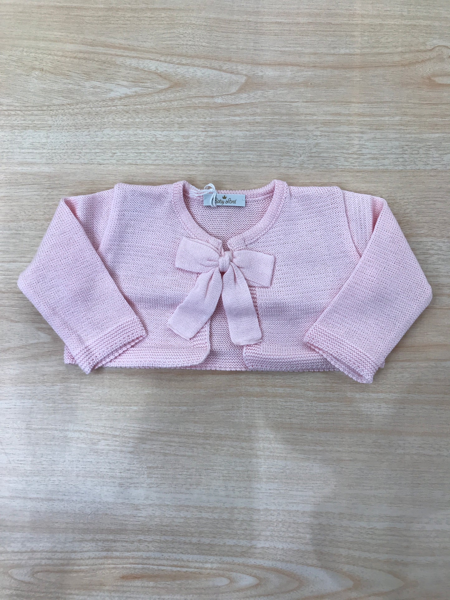Cardigan Baby Lord in filo rosa manica lunga con fiocchetto sul davanti