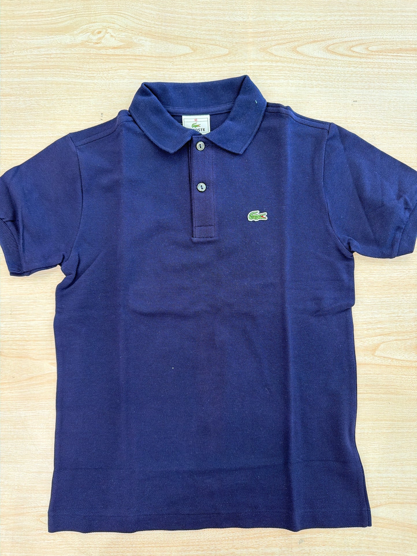 Polo Lacoste in cotone mezza manica con bottoncini e logo ricamato lateralmente unisex