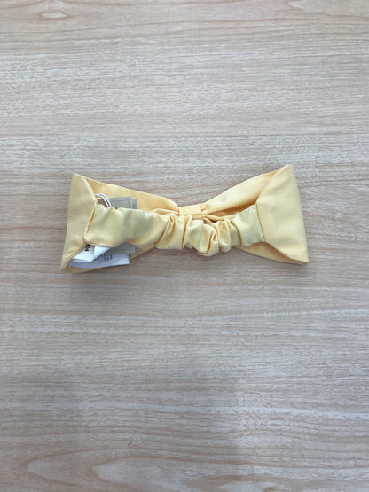 Fascia Le Bebè in cotone giallo a forma di fiocco con elastico sul retro